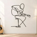 Guitariste assis en métal noir, décoration murale musique