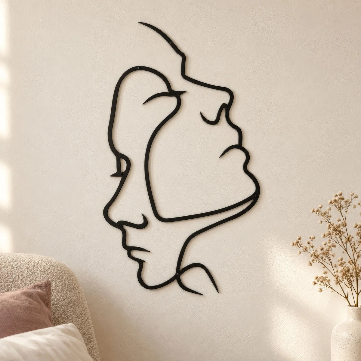 Deux visages en trait continu, décoration murale en métal noir