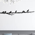 Branche aux oiseaux perchés en métal noir, déco panoramique